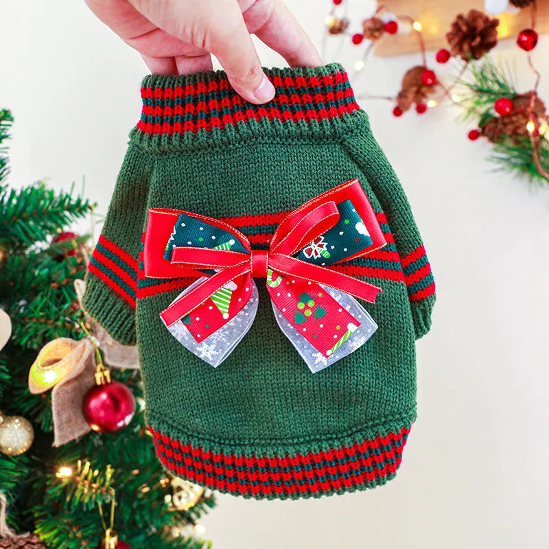 Red 'Merry Christmas' knitted jumper on a small dog, showing festive pattern and full-body fit.