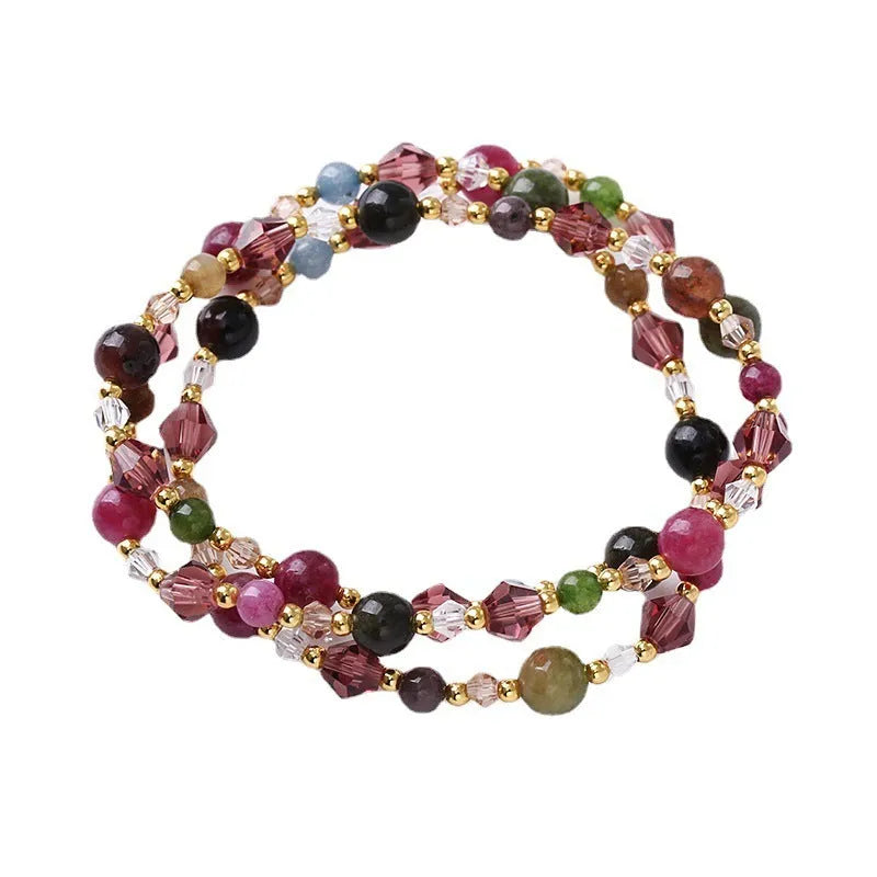 Women's three-ring crystal bracelet in tourmaline, strawberry quartz, or amethyst on an adjustable cord.