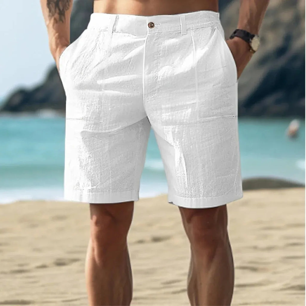 Men's straight-leg casual trousers in cotton linen blend, showing button fly and five-pocket design in dark blue.