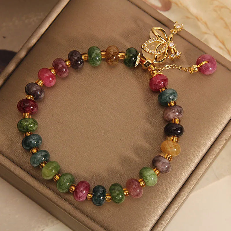 Colourful women's bracelet with alloy butterfly charm and tourmaline beads for casual wear
