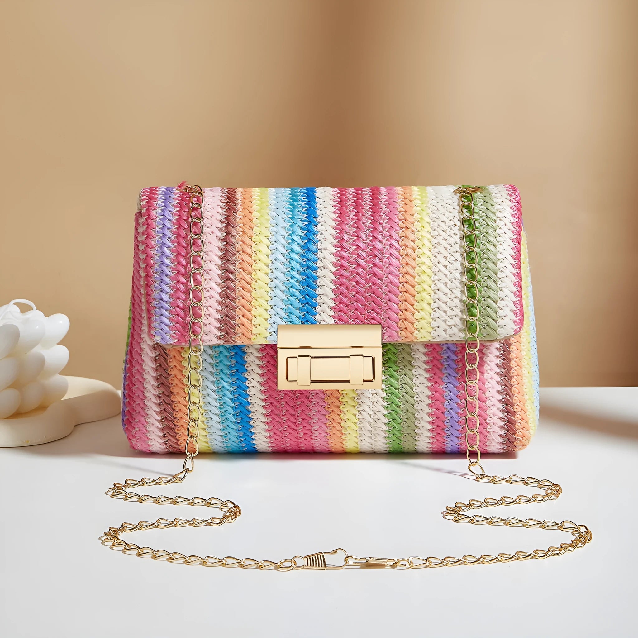 Women's soft straw cross-body bag in square shape with phone pocket, shown in blue colour