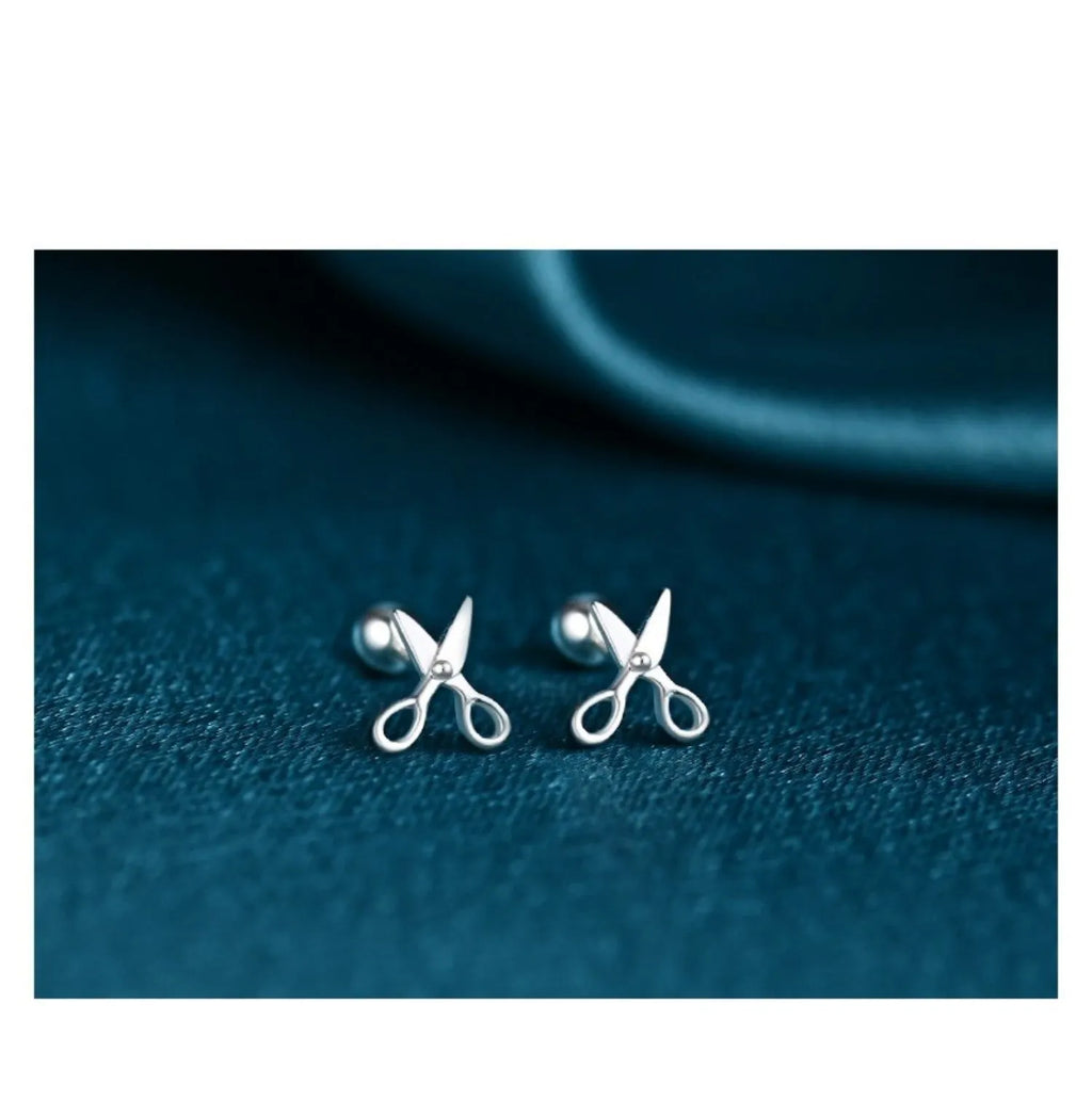 A pair of S999 pure silver ear nail earrings with a mini scissors and screws design.