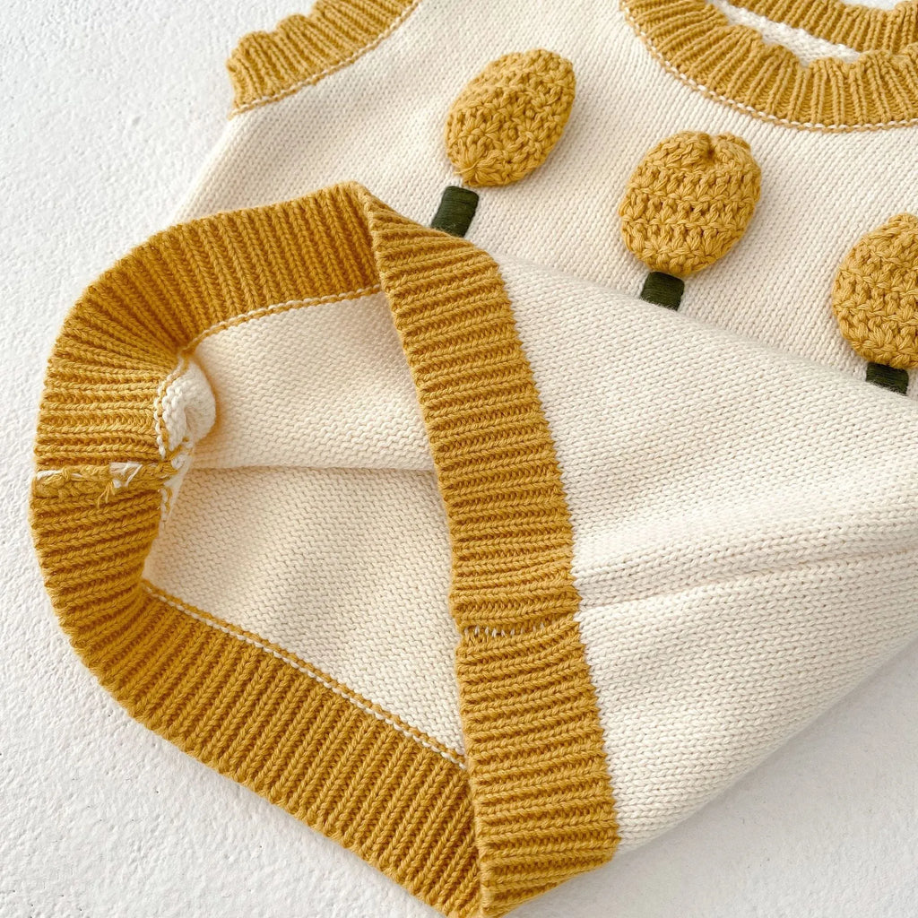 Baby girl sleeveless knitted pullover top in almond white with three-dimensional flower detail, spring autumn cotton knit