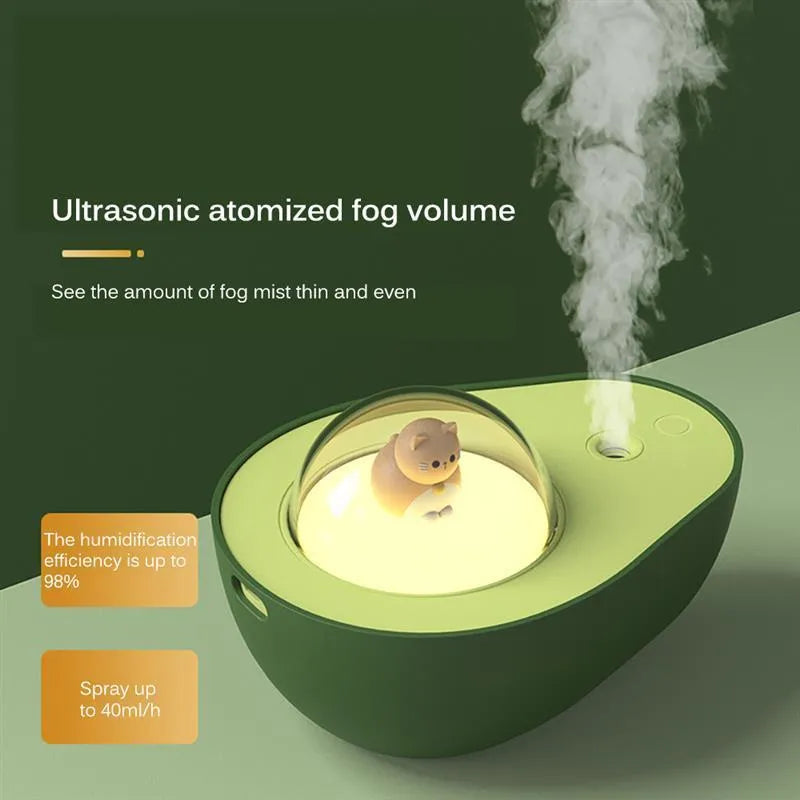 Green avocado-shaped mini USB humidifier with night light on a desk