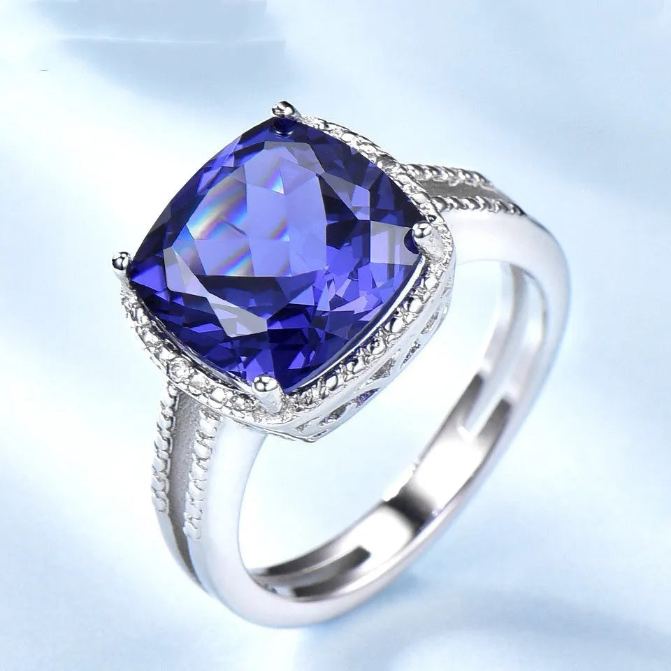 Close-up of a women's sterling silver ring with a genuine blue tanzanite stone.