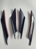 Set of four ABS plastic bumper air knife spoilers in a carbon fibre finish for car modification.