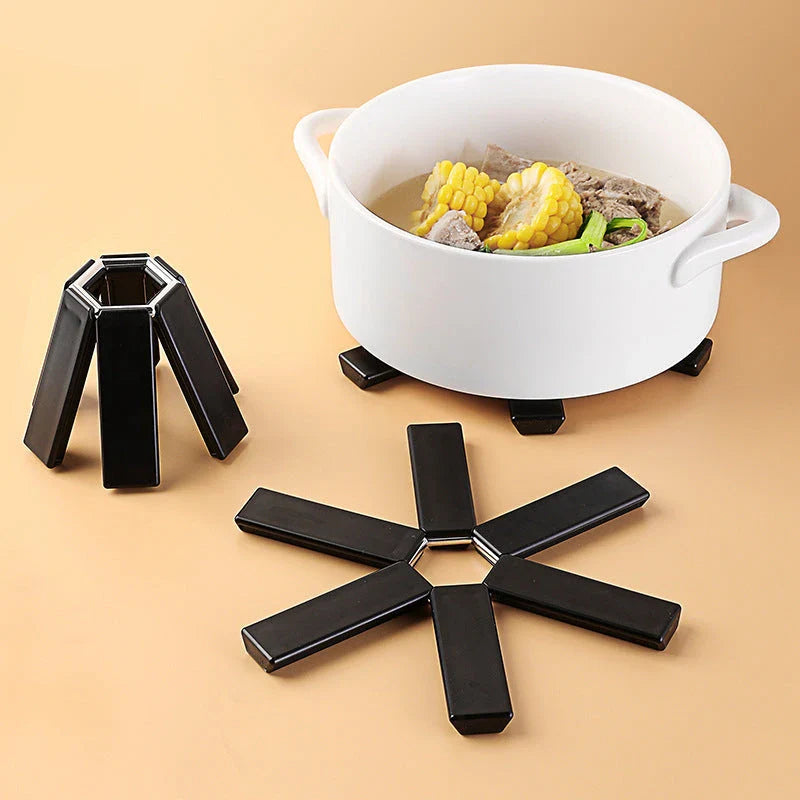 Folding pan mat made of heat-resistant ABS material with anti-slip and anti-scald features, suitable for kitchen, restaurant, and baking use