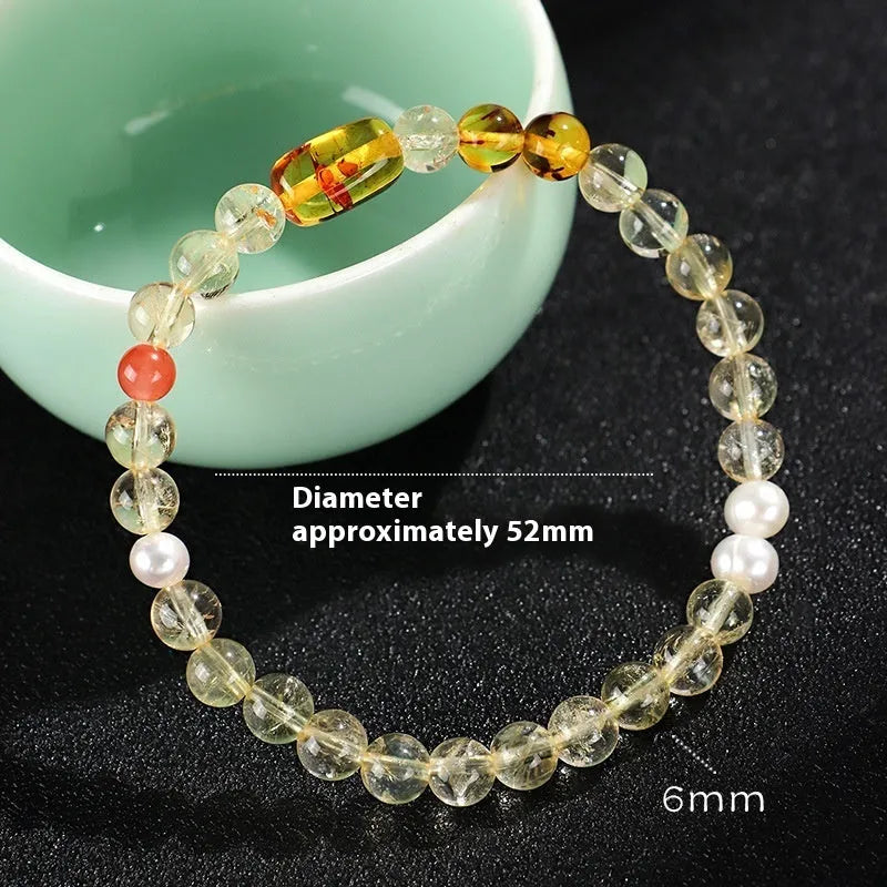 Handmade women's bracelet featuring freshwater pearls combined with citrine crystals