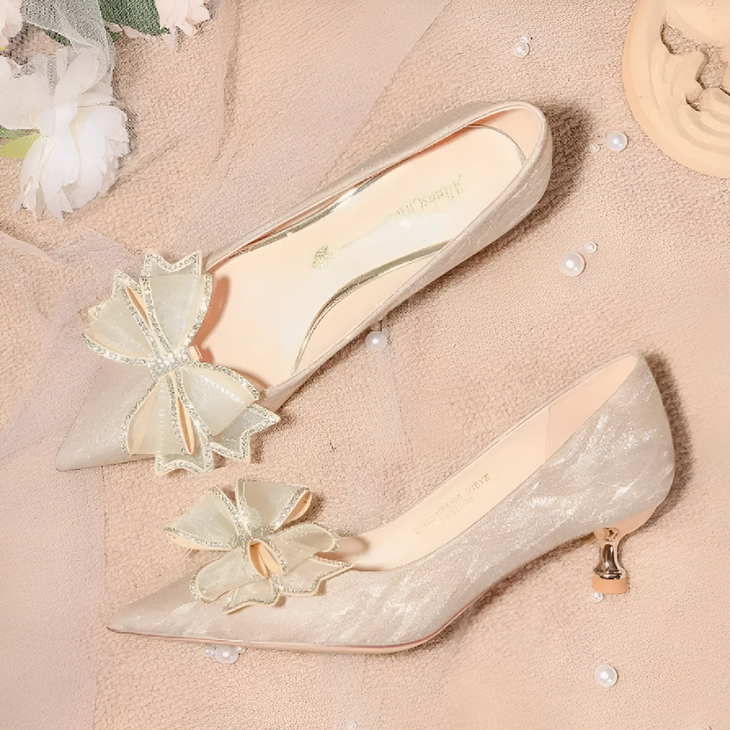 Champagne coloured sequined pointed toe high heel stiletto pumps with crystal detail.