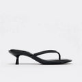 Women's round toe mid-heel summer sandals in black with a flip-flop strap and rubber sole.