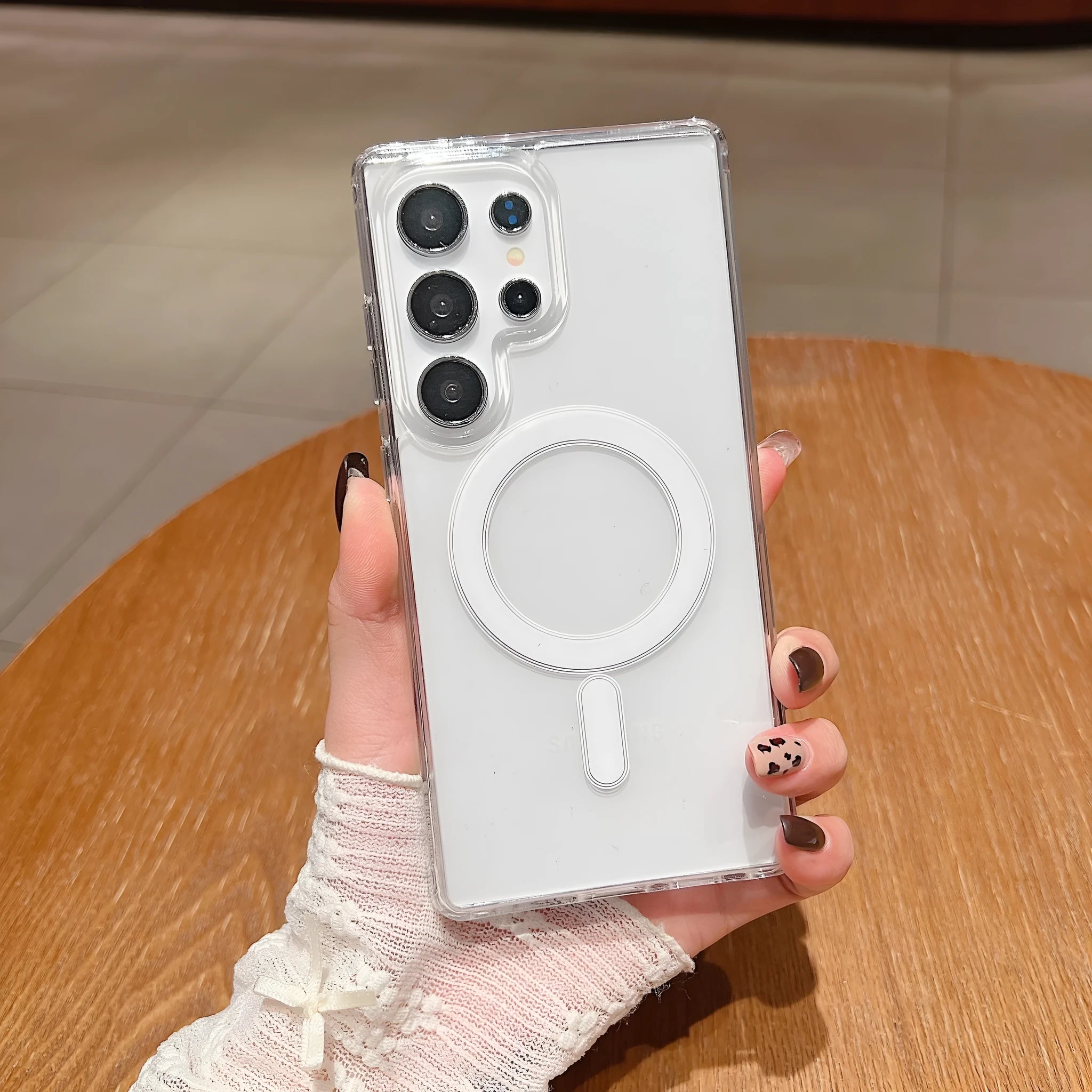 Transparent magnetic silicone phone case for Samsung Galaxy smartphones on a flat surface.