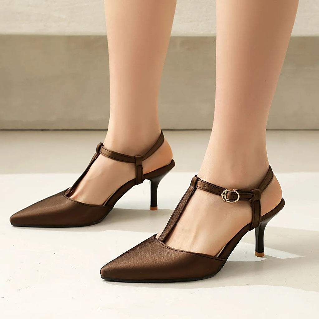 Women's pointed toe T-strap high heels in black top grain leather with unlined inner