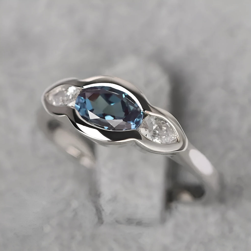 Women's geometric ellipse ring with inlaid zircon stones in white gold finish on copper