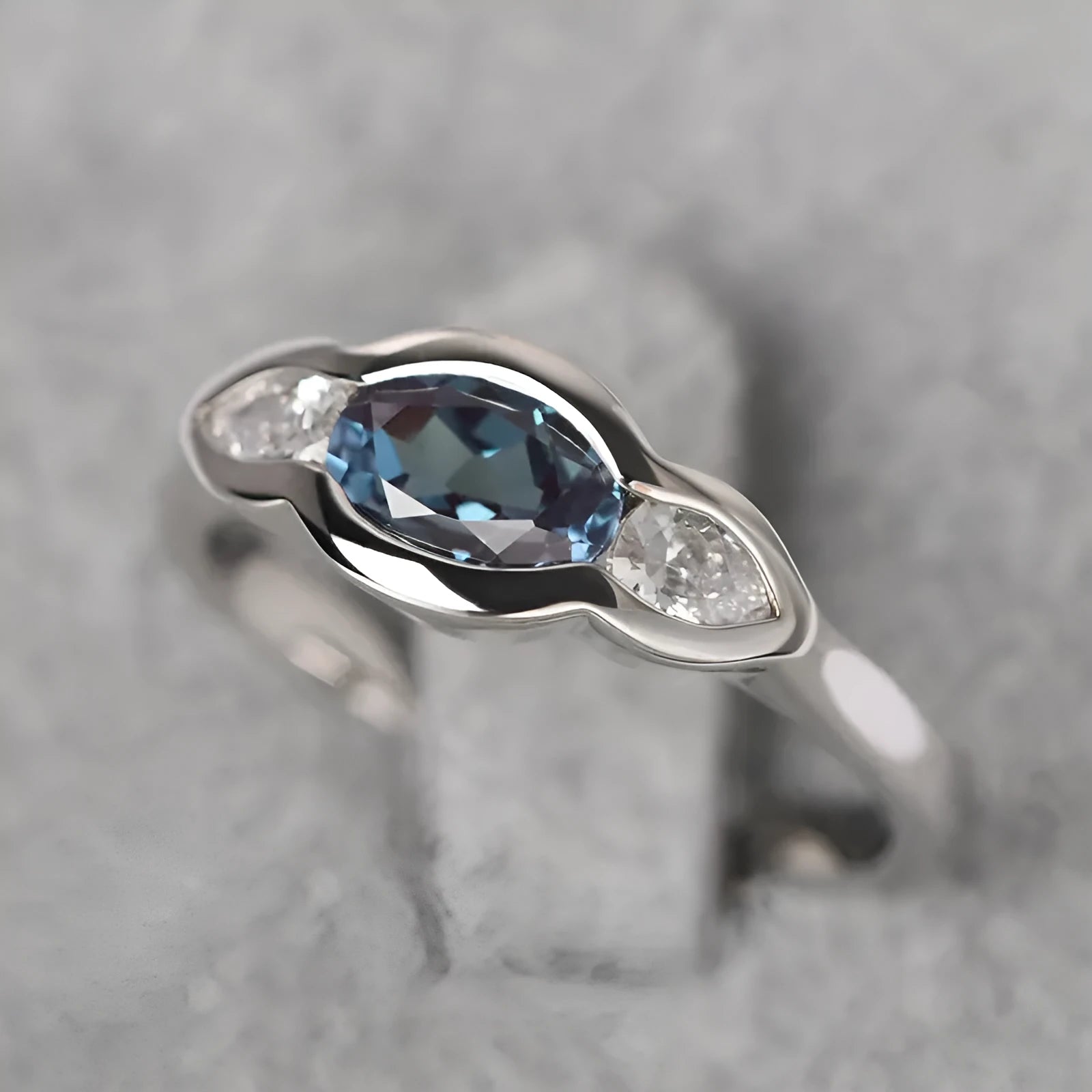 Women's geometric ellipse ring with inlaid zircon stones in white gold finish on copper
