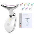 Black and silver EMS thermal neck lifting massager with LED lights on a skincare shelf.