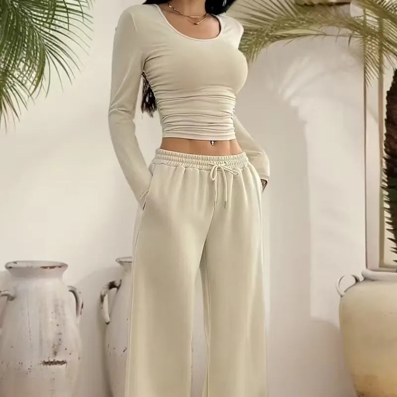 Women's long sleeve solid colour vest and pants suit in beige white polyester knit, sizes S to XL