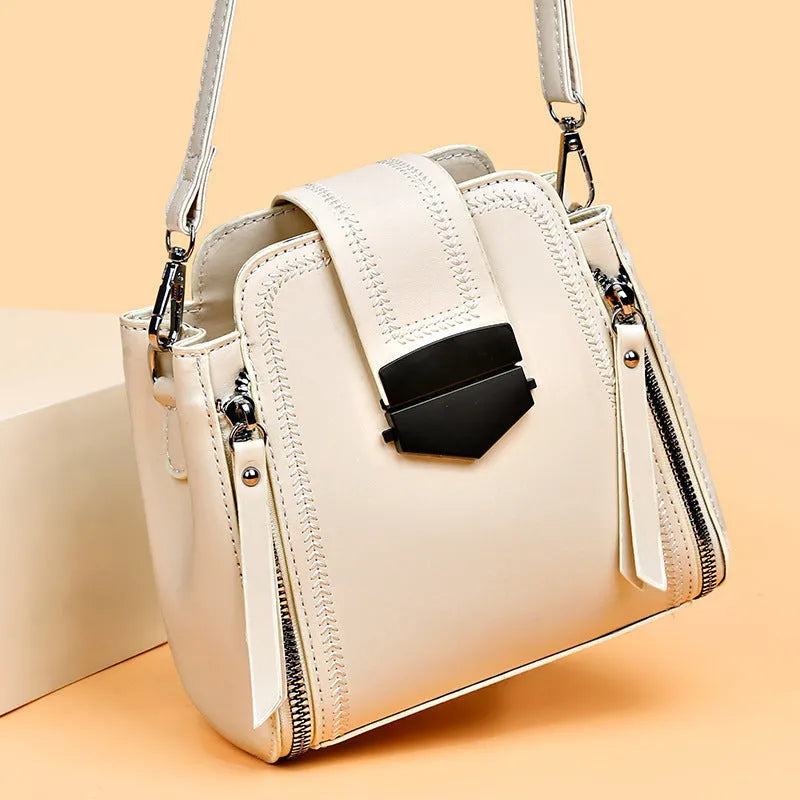 Small square vertical handbag in soft textured PU leather with zip closure and sewing thread detail