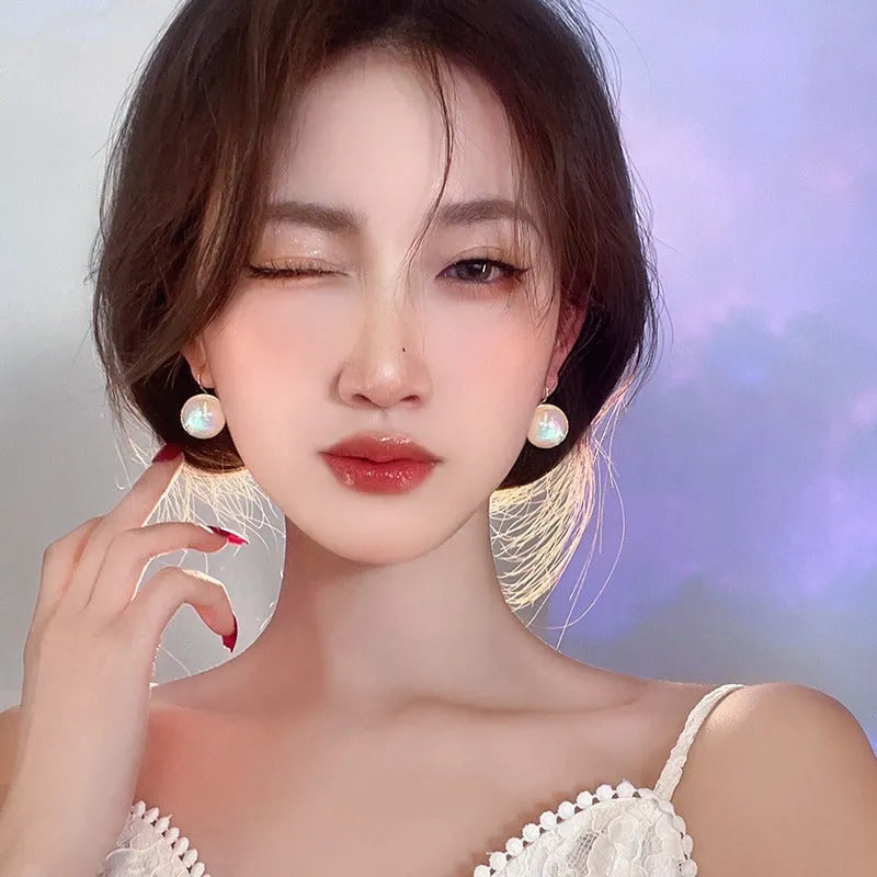 Geometric round mermaid pearl ear clips with colourful electroplated finish and anti-lost design