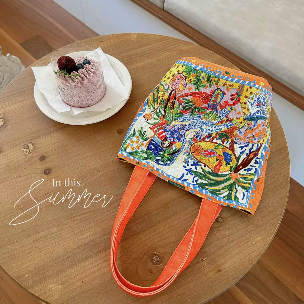 Dream Garden orange plush canvas Thailand artistic bucket bag with double straps and printed details.