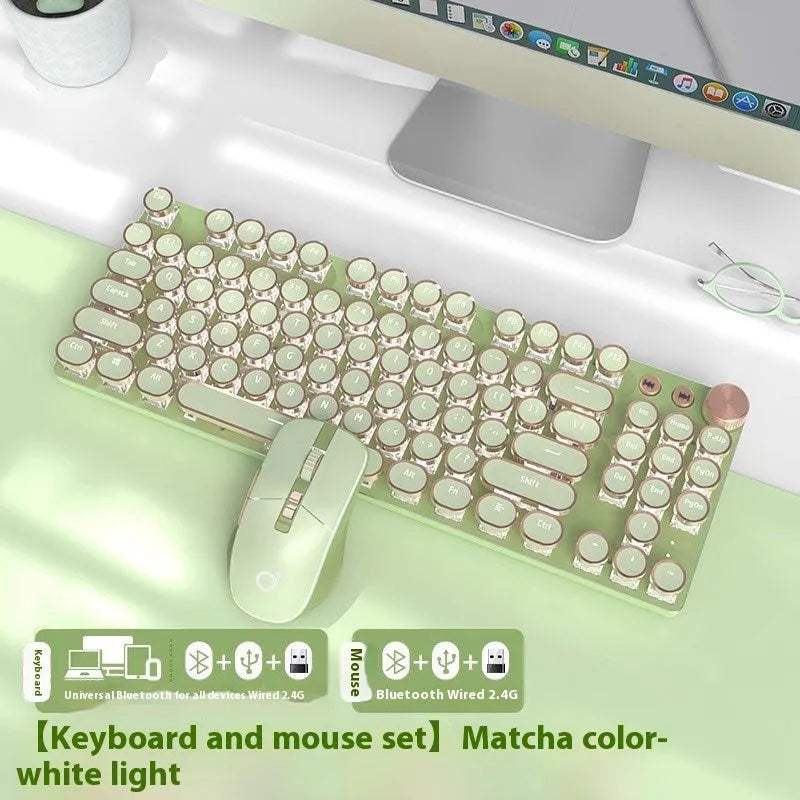 Matcha green 87-key mechanical gaming keyboard with aluminium frame and white backlighting on a desk.