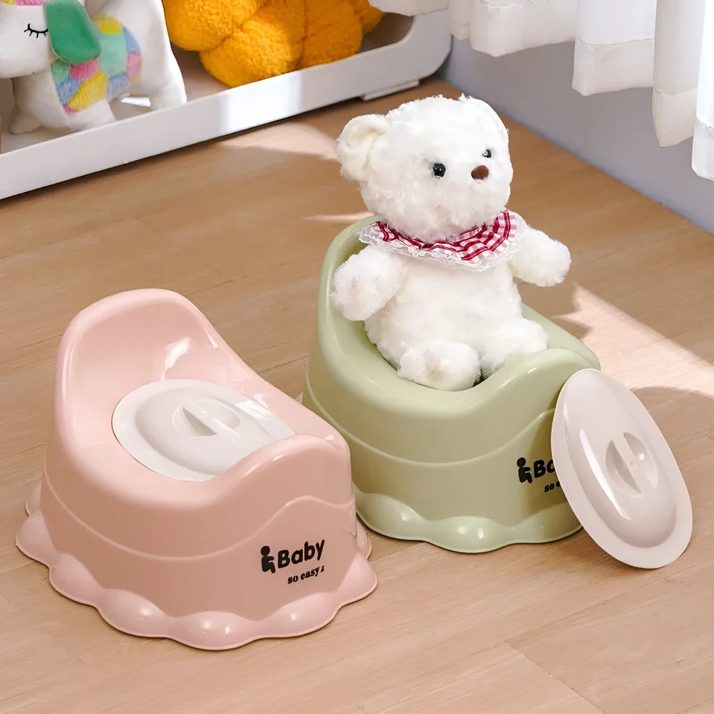 Children's portable thickened toilet in green, pink, and blue with lid option on a white background
