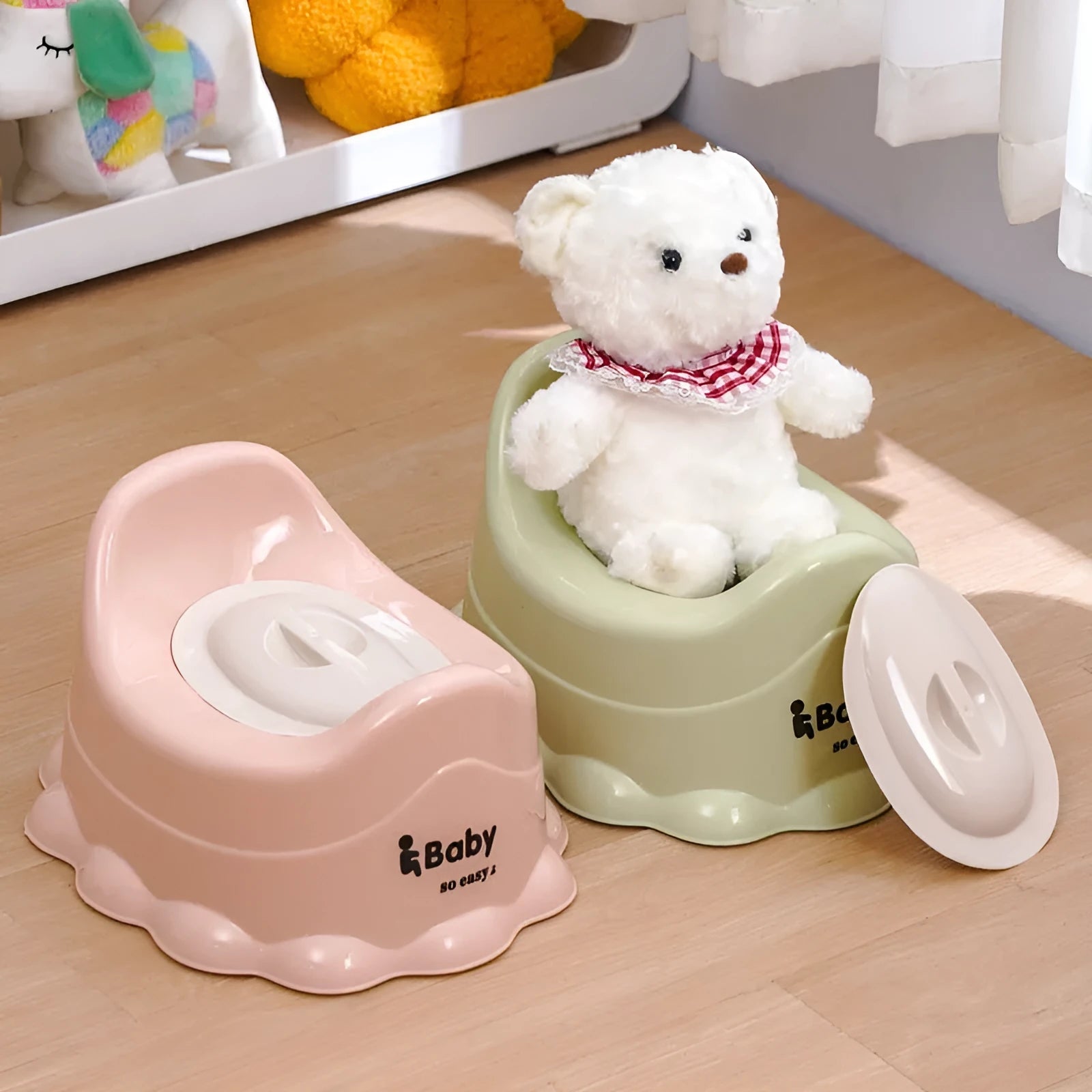 Children's portable thickened toilet in green, pink, and blue with lid option on a white background