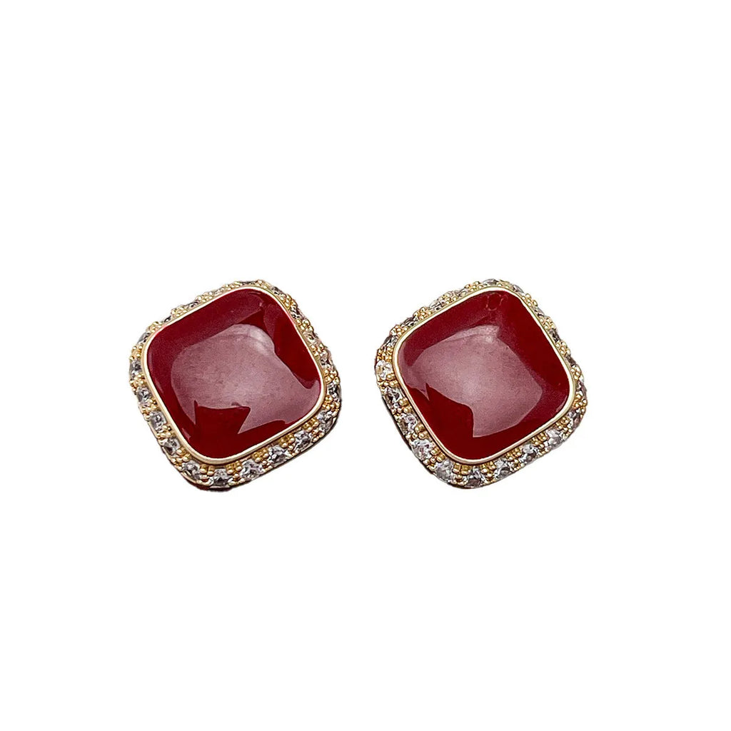 A pair of retro red square geometric alloy earrings with an inlaid design detail.