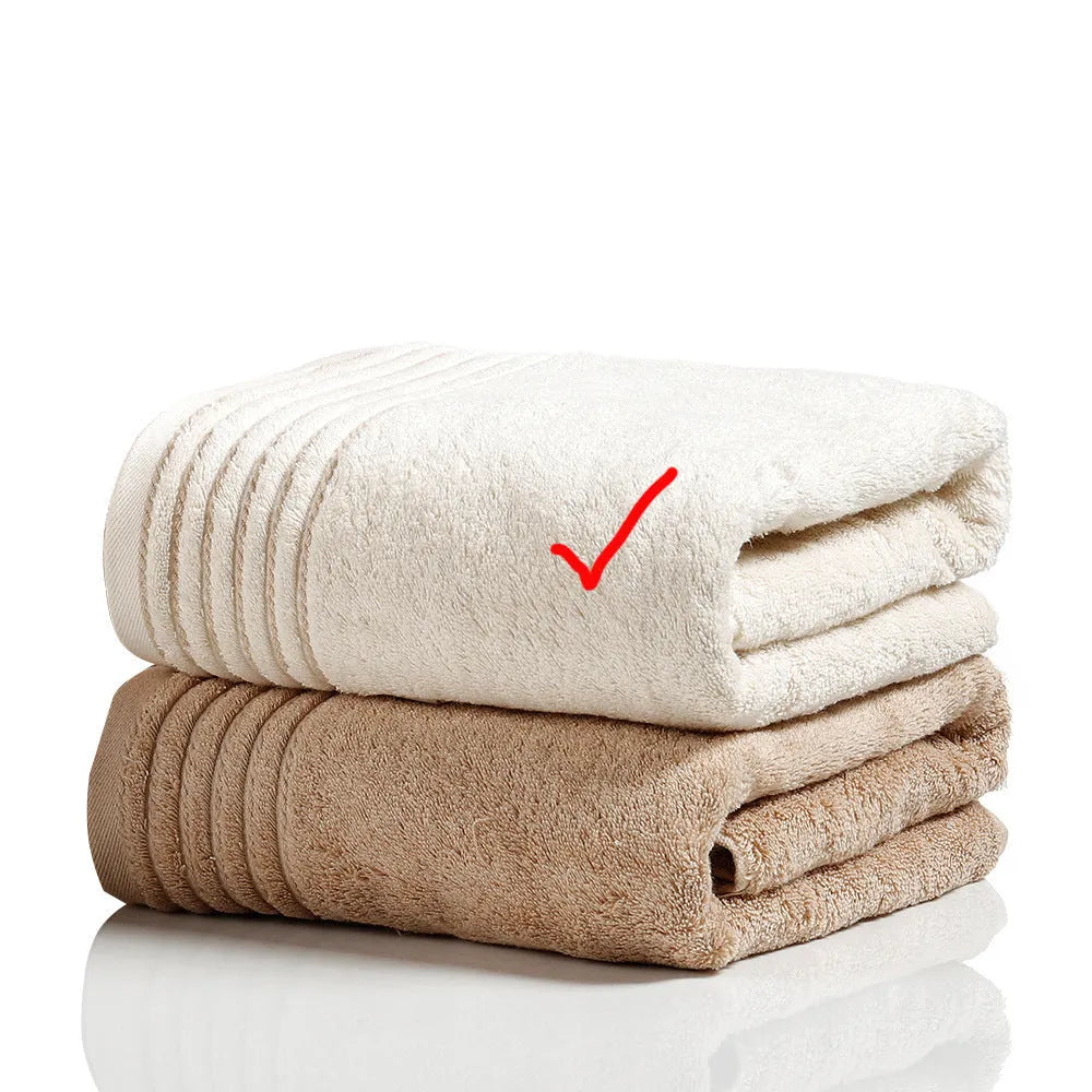 Cotton towel set in beige and brown showing face, hand, and bath towel sizes