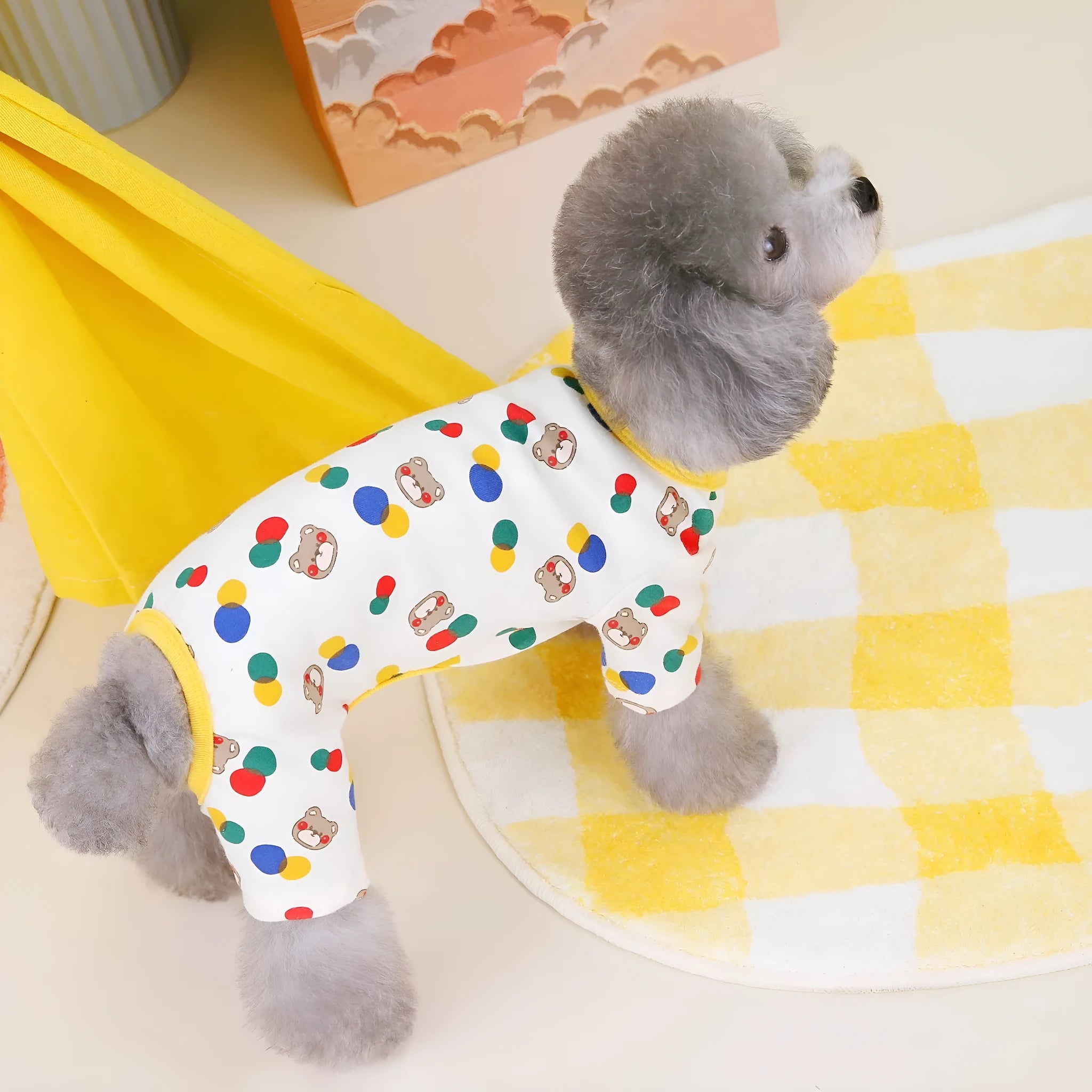 Beige dog jumper with colourful ball bear pattern, showing casual cotton spandex construction.