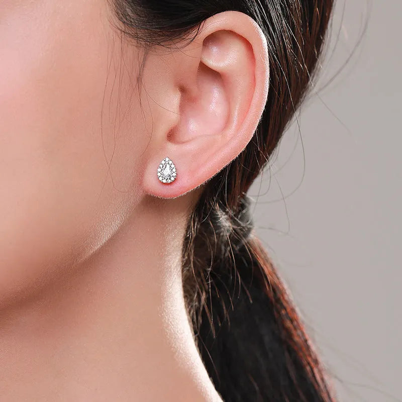 Women's drop shape ear studs in 925 sterling silver with diamond treatment