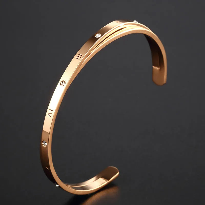 Open-ended women's bracelet with zircon stones in stainless steel, showing rose gold colour option