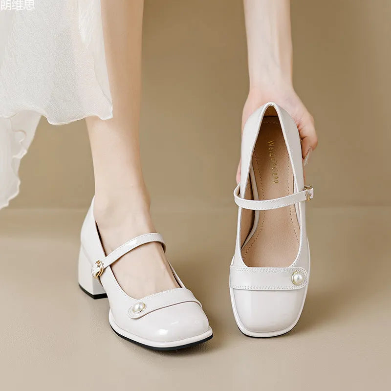 French style chunky heel pump shoes with buckle closure in patent leather, showing square toe design.