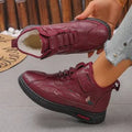 Black women's low-tube velvet cotton shoes with a hollow-out design and non-slip rubber sole.