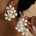 Retro floral earrings for women in black or white with iron construction and baking varnish finish