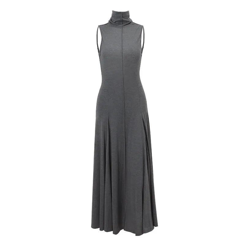 Grey slim-fit cotton dress with half turtleneck and backless design on a mannequin.