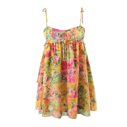 Elegant floral suspender dress with ruffled design, perfect for summer fashion