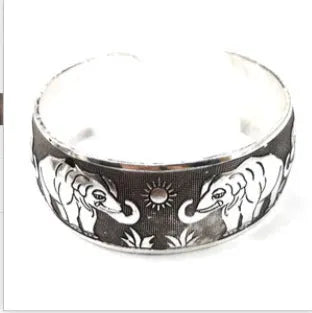 Miao-inspired ethnic bracelet with carved open design in elephant colour Roman shape