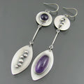 Geometric alloy earrings with antique silver finish and crystal gemstone details