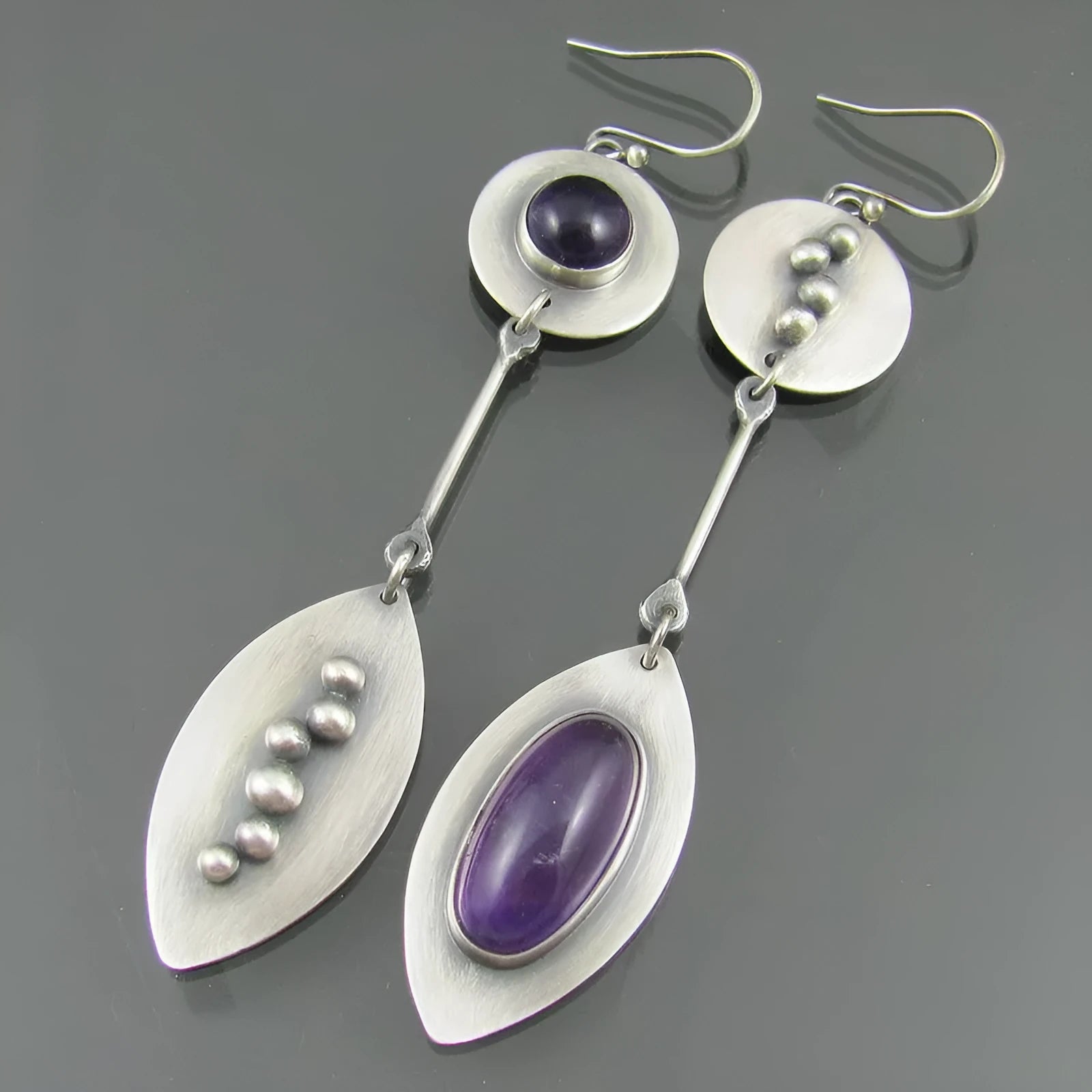 Geometric alloy earrings with antique silver finish and crystal gemstone details
