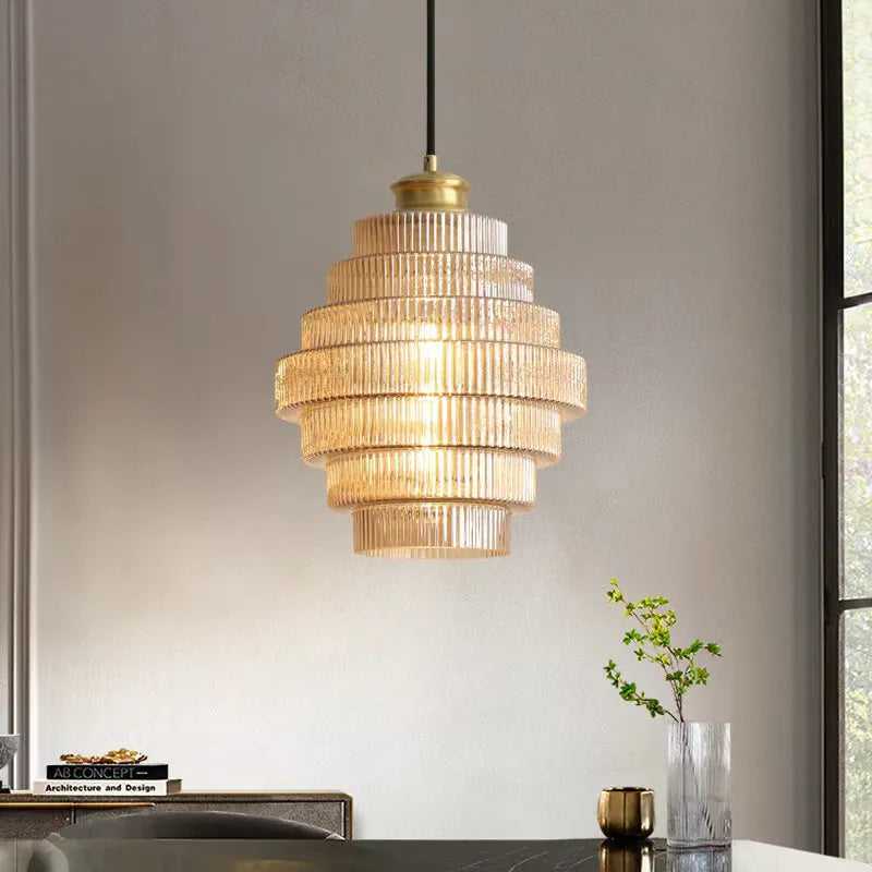 Modern simple pendant drop light in smoked grey or amber glass for hallway or bedroom.