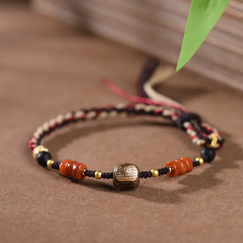 Close-up of a hand-woven flexible wire bracelet for women with a Lapis Lazuli stone accent.