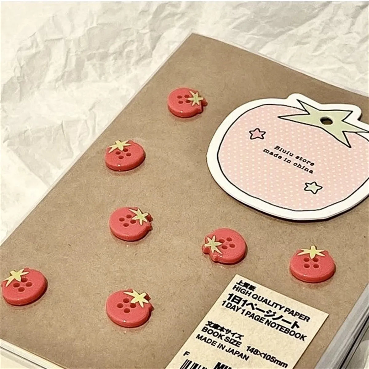 Mini tomato red fabric simulation button with vintage antique style on white background