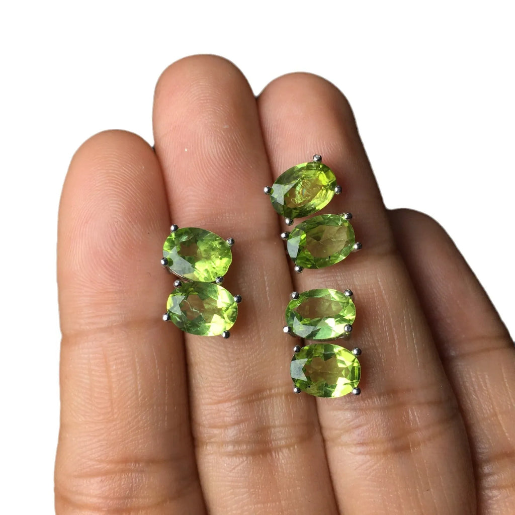 Natural grass green olivine 6x8mm elliptical stud earrings in sterling silver setting