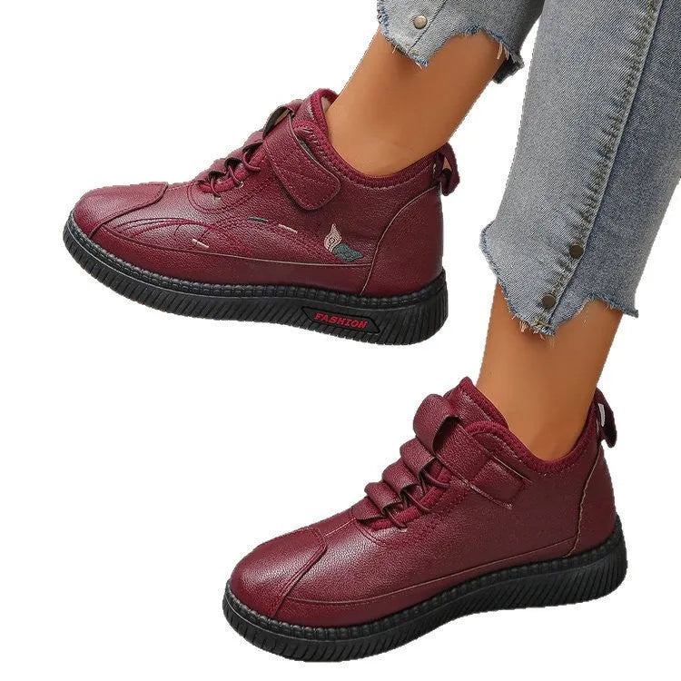 Black women's low-tube velvet cotton shoes with a hollow-out design and non-slip rubber sole.