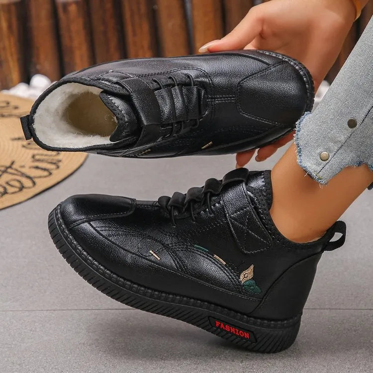 Black women's low-tube velvet cotton shoes with a hollow-out design and non-slip rubber sole.