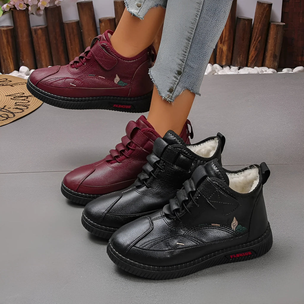 Black women's low-tube velvet cotton shoes with a hollow-out design and non-slip rubber sole.