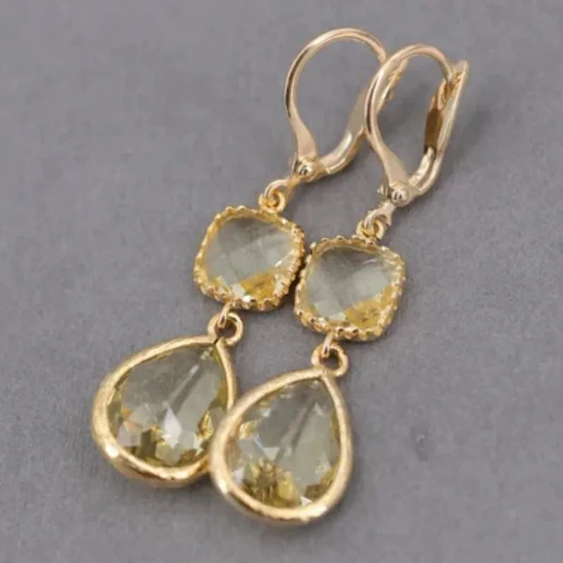 Gold geometric long fringe drop earrings with exaggerated crystal and water droplet design
