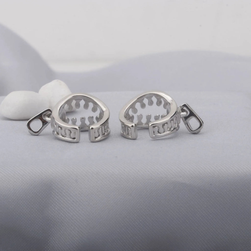 Copper geometric clip-on earrings with linear design elements in colour ES862
