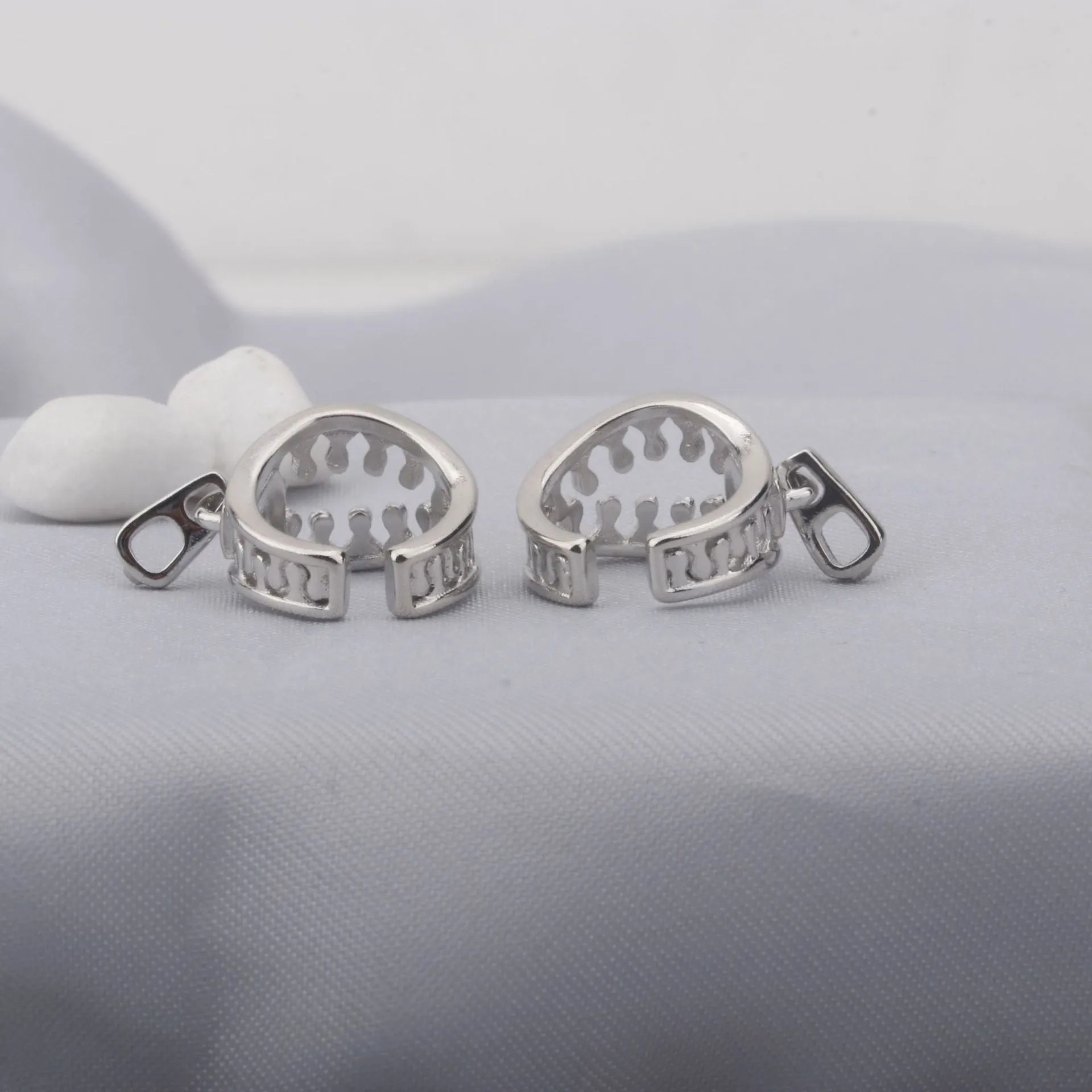 Copper geometric clip-on earrings with linear design elements in colour ES862