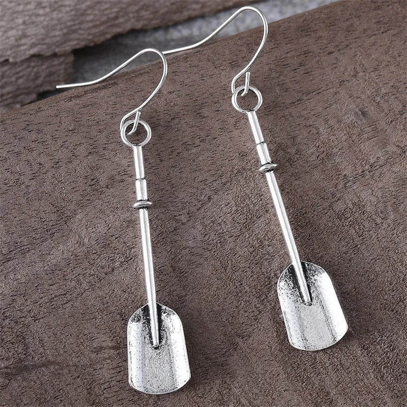 Long geometric shovel-shaped earrings with ancient silver finish and ethnic styling